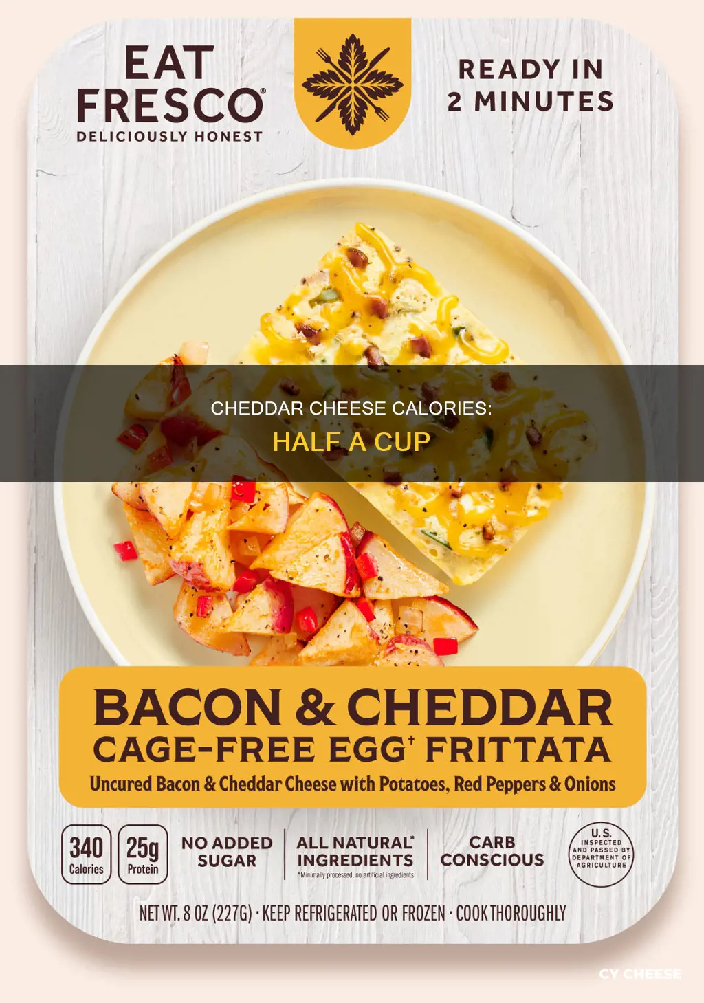 how many calories in half a cup of cheddar cheese