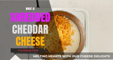 Unraveling the Mystery: What Exactly is Shredded Cheddar Cheese?