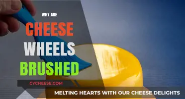 Why Cheese Wheels Are Brushed: Uncovering the Secret to Perfect Aging