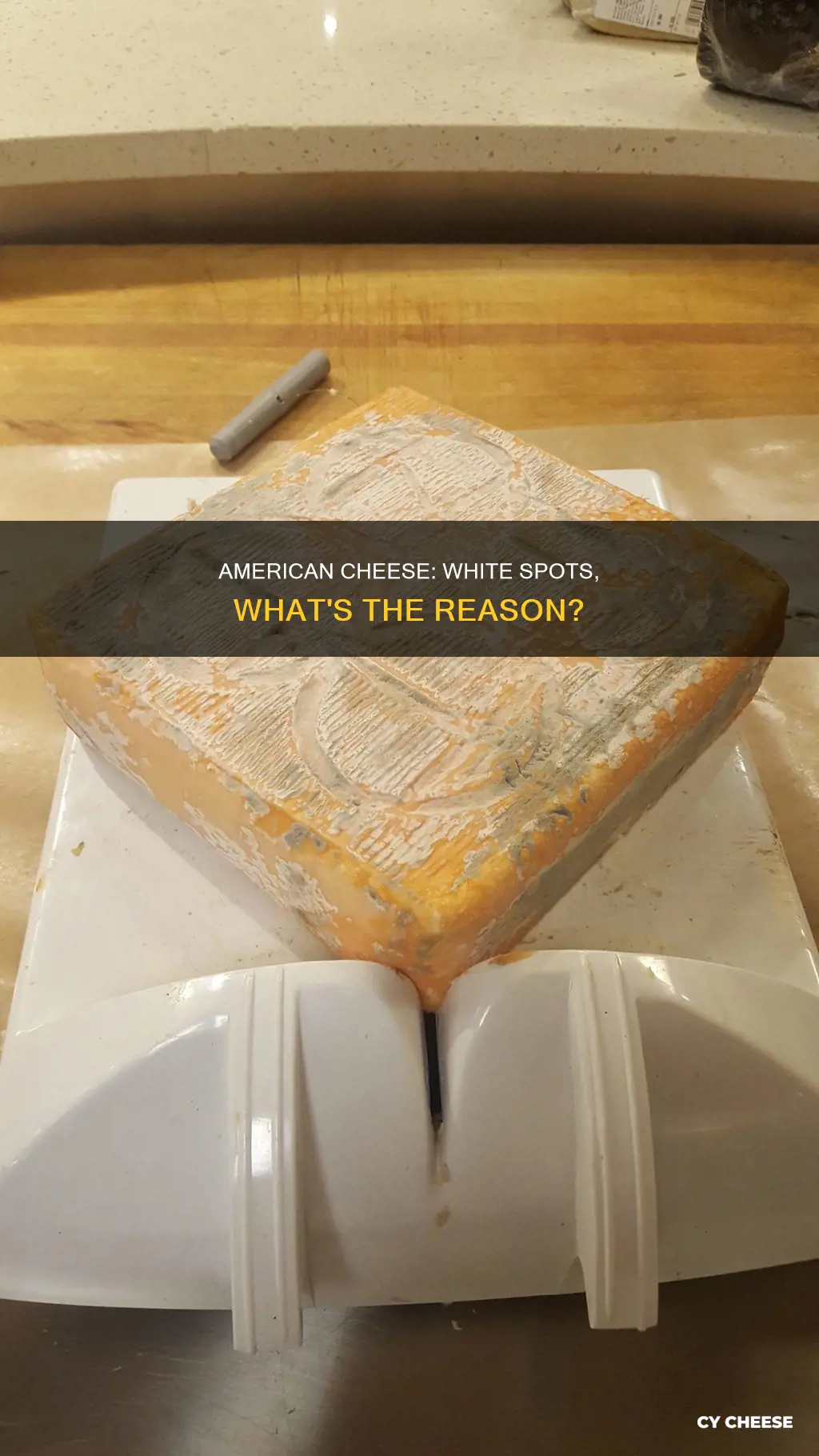 why does american cheese get white spots